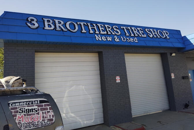 Sign painted on building.